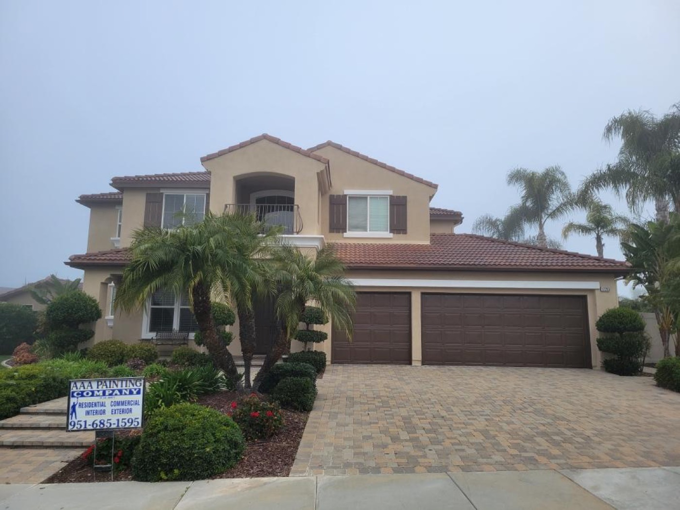 AAA Painting Company yard sign at a finished two-story repaint in the Inland Empire, CA
