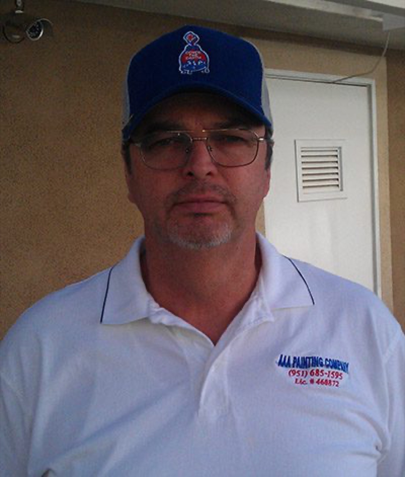 John, owner of AAA Painting, in company shirt in Jurupa Valley, CA