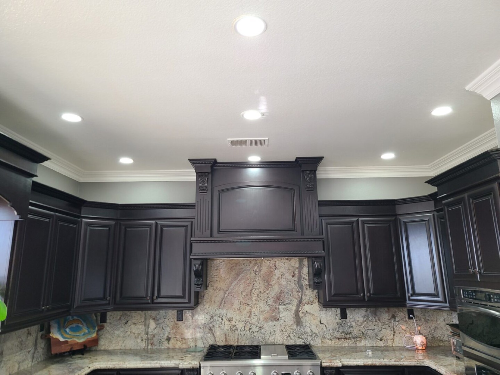 Espresso kitchen cabinets refinished by AAA Painting in the Inland Empire, CA